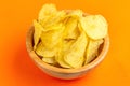 Tasty crispy potato chips in wooden bowl Royalty Free Stock Photo