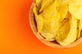 Tasty crispy potato chips in wooden bowl Royalty Free Stock Photo