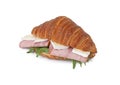 Tasty croissant with brie, ham and arugula isolated on white