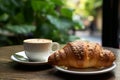 Tasty Croissant and Hot Coffee Served on a Rustic Coffee Table in a Charming City Cafe