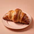 Tasty croissant on peach fuzz background