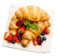 tasty croissants with berries on white background Royalty Free Stock Photo