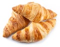 Tasty crusty croissant close-up on a white background