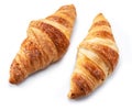 Tasty crusty croissants close-up on a white background. Top view
