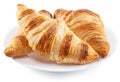 Tasty crusty croissants on the plate on white background. File contains clipping path