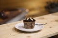 Tasty cupcake chocolate, on wooden table