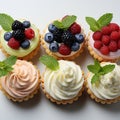 Tasty cupcakes with berries and mint on white background, top view