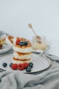 Tasty curd cheesecakes with berries on a plate