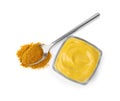Tasty curry sauce and powder isolated on white, top view Royalty Free Stock Photo