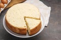 Tasty cut sponge cake on grey table Royalty Free Stock Photo