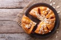 Tasty cutting almond pear pie closeup top view of the horizontal Royalty Free Stock Photo