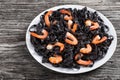 Tasty Cuttlefish ink black noodles with prawns on white dish Royalty Free Stock Photo