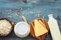 Tasty dairy products on color wooden table