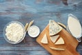 Tasty dairy products on color wooden table