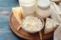 Tasty dairy products on wooden board