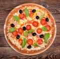 Tasty delicious pizza on the old boards Royalty Free Stock Photo