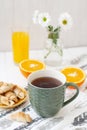 A tasty desert: a cup of tea, a glass of juice, a plate of biscuits Royalty Free Stock Photo