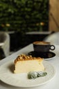 Tasty dessert and cup of fresh coffee on table in cafeteria