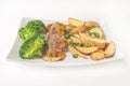 Tasty dinner - roast veal with fried potatoes and broccoli isolated