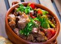 Tasty dish ghiveci of bulgarian cuisine of beef with paprika at clay pot Royalty Free Stock Photo