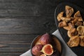 Tasty dried and raw figs on black  table, flat lay. Space for text Royalty Free Stock Photo