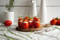 Stuffed tomato with chicken, garlic and cream cheese pasta lying on a brown wooden board