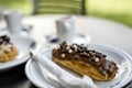 Tasty eclair pastry filled and covered  with chocolate Royalty Free Stock Photo