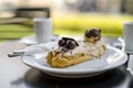 Tasty eclair pastry filled and covered  with chocolate Royalty Free Stock Photo