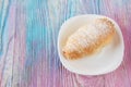Tasty eclair on plate Royalty Free Stock Photo