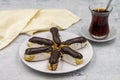 Tasty eclairs and cup of tea on stone table. Traditional french dessert. Pastry products Royalty Free Stock Photo