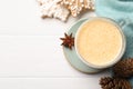 Tasty eggnog, cookies and anise star on white wooden table, flat lay. Space for text Royalty Free Stock Photo