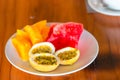 Tasty exotic fruits on breakfast at outdoor restaraunt Royalty Free Stock Photo