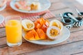Tasty exotic fruits - ripe passion fruit, mango on breakfast at outdoor restaraunt Royalty Free Stock Photo