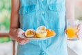 Tasty exotic fruits - ripe passion fruit, mango on breakfast at outdoor restaraunt Royalty Free Stock Photo