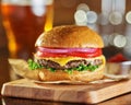 Tasty fast food style cheese burger with beer