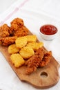 Tasty Fastfood: Chicken Nuggets, Wings and Tenders with Ketchup, side view. Copy space Royalty Free Stock Photo