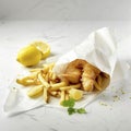 Traditional fish and chips with lemon on white background Royalty Free Stock Photo