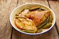 Tasty fish curry cooked in coconut milk on wooden table Royalty Free Stock Photo