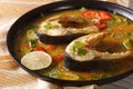 Tasty fish curry with vegetables close-up on a plate. Royalty Free Stock Photo