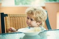 Tasty food, cute child eating spaghetti. The child in the kitchen at the table eating pasta. Italian food for children.