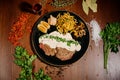 Tasty fragrant pork chops served in a creamy cheese sauce in a pan on the table.Top view Royalty Free Stock Photo