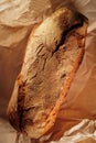 Tasty french bread in paper from bakery