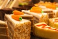 Tasty fresh cakes in showcase. Bakery in cafeteria. Baked croissants, carrot and chocolat cake. Pastry closeup. Royalty Free Stock Photo