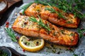 Tasty and fresh cooked salmon fish fillet with lemon and rosemary