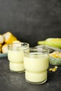 Tasty fresh corn milk in glass on grey table Royalty Free Stock Photo