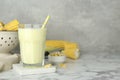 Tasty fresh corn milk in glass on white marble table. Space for text Royalty Free Stock Photo