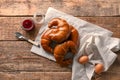 Tasty fresh crescent rolls with sweet jam on wooden table, top view Royalty Free Stock Photo