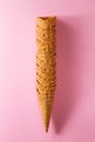 Tasty fresh empty ice cream cones on pink vibrant background.