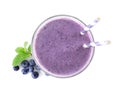 Tasty fresh milk shake in glass and blueberries on background, top view Royalty Free Stock Photo