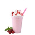 Tasty fresh milk shake in plastic cup with raspberries on background Royalty Free Stock Photo